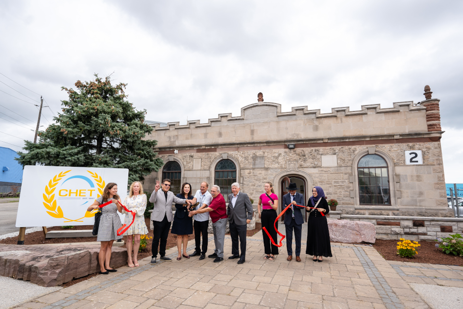 Ribbon cutting in front of the new campus.